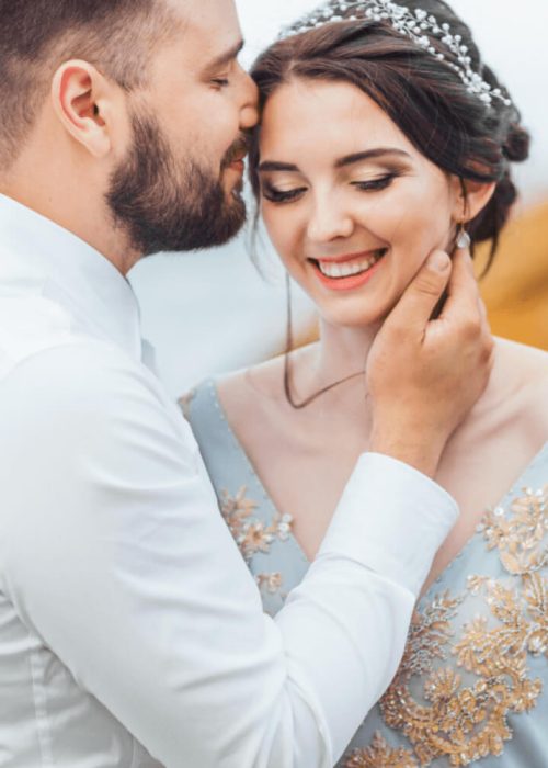 same-couple-with-a-bride-in-a-blue-dress-walk-L2LXSTS.jpg